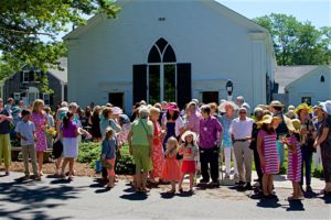 parishioners gathered outside Dennis Union Church on a summer Sunday